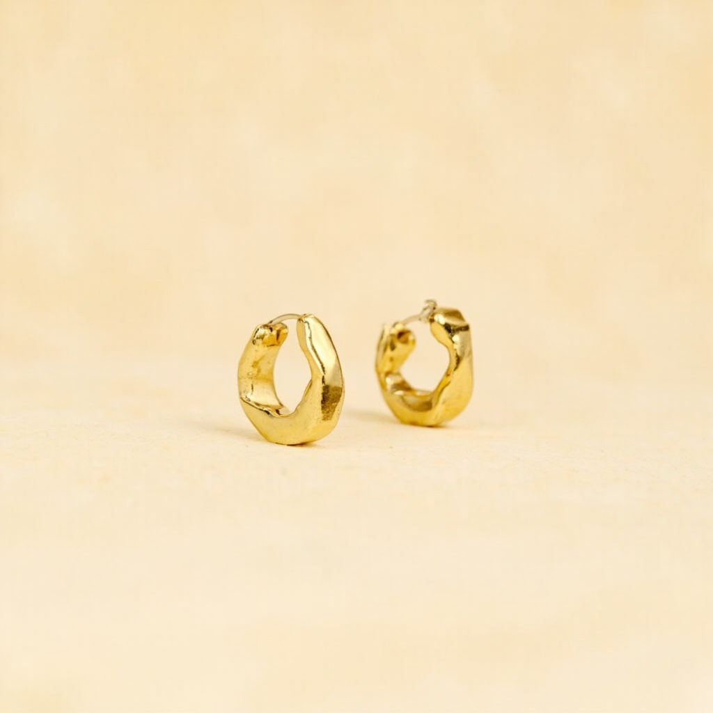 Gold hoop earrings saved from Mejuri